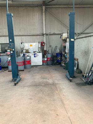a picture of a garage with a lot of tools on the floor