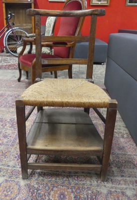 chairs and a table in a room with a red wall