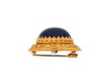 an image of a gold and lapel pin with a blue stone