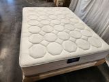 the mattress is sitting on a pallet in the warehouse