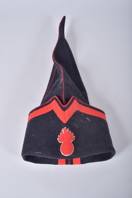a black and red hat with a red bird on it