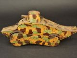 camouflaged wooden toy tank with wheels on a black background