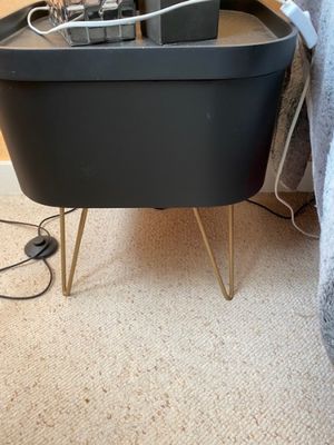 an image of a black table with a laptop on it