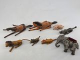 a lot of toy animals that are laying on the ground
