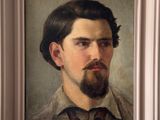 portrait of a man with a beard in a white frame