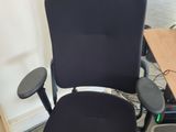 a black office chair with a black seat and back rest