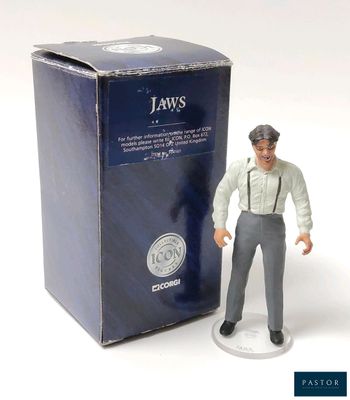 a figurine of a man standing next to a box