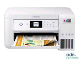 a white printer sitting on top of a desk next to a magazine