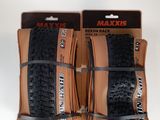 two black and brown bicycle tires are on display in front of a white background