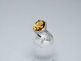 a close up of a ring with a citrine stone in it
