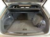 a trunk of a car with luggage in it