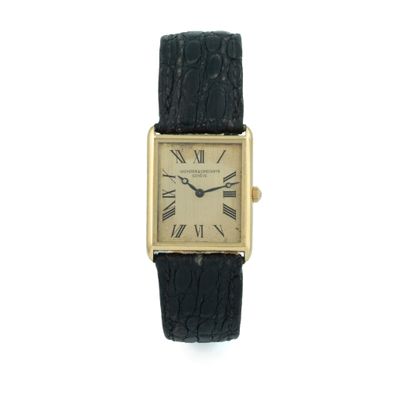 an image of a gold plated wrist watch with roman numerals
