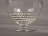 a glass bowl that is sitting on a table