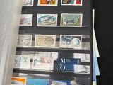 a binder with stamps on it and a roll of paper next to it
