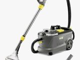 un gros plan d'un aspirateur muni d'un tuyau et d'une brosse