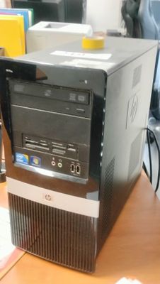 a desktop computer sitting on top of a wooden desk