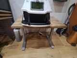 a machine that is sitting on top of a wooden table