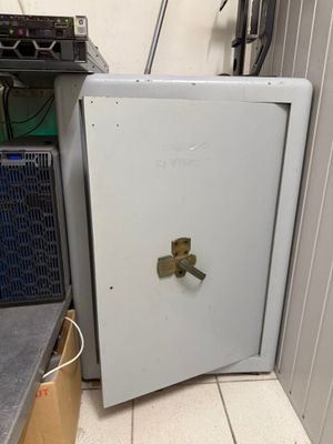 a white refrigerator with a door open in a room