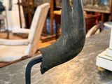 a close up of a statue of a bird on a table