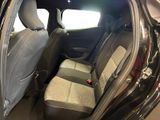 the back seats of a car that is in a showroom