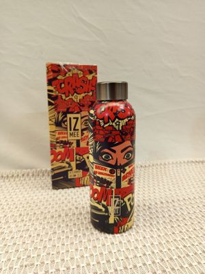 a close up of a bottle and a box on a table