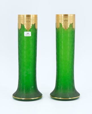 pair of green and gold vases on a white background