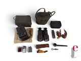 an image of a collection of items including a camera, a bag, a pipe, a cigarette, a lighter, and other items
