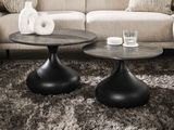two tables that are sitting on a rug in a living room