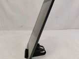 a tablet computer sitting on a stand on a white surface