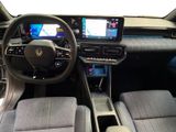 the interior of a car with a steering wheel, dashboard, and touch screen