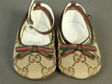 guccissi children ' s shoes with red and green bows