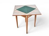 an image of a small table with a green tile top and legs
