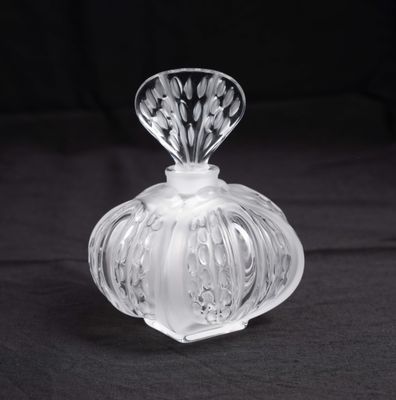 crystal glass perfume bottle on a black background photo