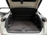 a trunk of a white car with its doors open