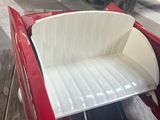 a red truck with a white tray in the back