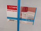 a clear container with a blue handle on it