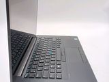 a laptop that is open on a white surface