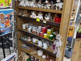 many stuffed animals on the shelves in the store
