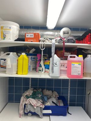 a washer and dryer on a shelf in a bathroom