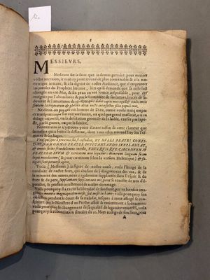 an open book with a black and white image of a bird on it ' s cover