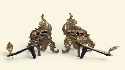 pair of antique brass figurines of lions and swords