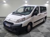 a picture of a small white van parked in a room