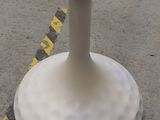 a white pedestal with a hole in the middle of it