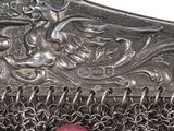 a close up of a chainmail with pearls on it
