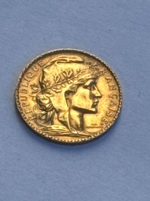 an image of a gold coin with a woman ' s face on it