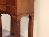 a small wooden table with a drawer on top of it