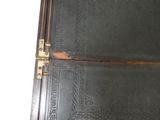 a black book that is open on a table