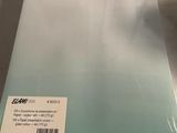 the back of a white and blue book sitting on a table