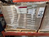 a large stack of boxes on a shelf in a store