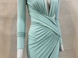 a mannequin wearing a green dress on a mannequin mannequin mannequin mannequin mannequin mannequin mannequin mann